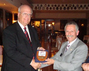 Lt. Gen. Leonidas Mazarakis, HAF (Ret.) (r), chapter president, presents the chapter's crest to Kent R. Schneider, president and chief executive officer of AFCEA International, during a visit in May.